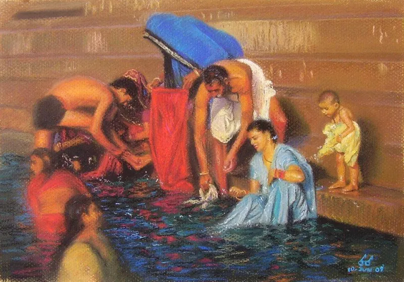 Mujeres y niños con ropas de colores bañándose en las aguas del Ganges.